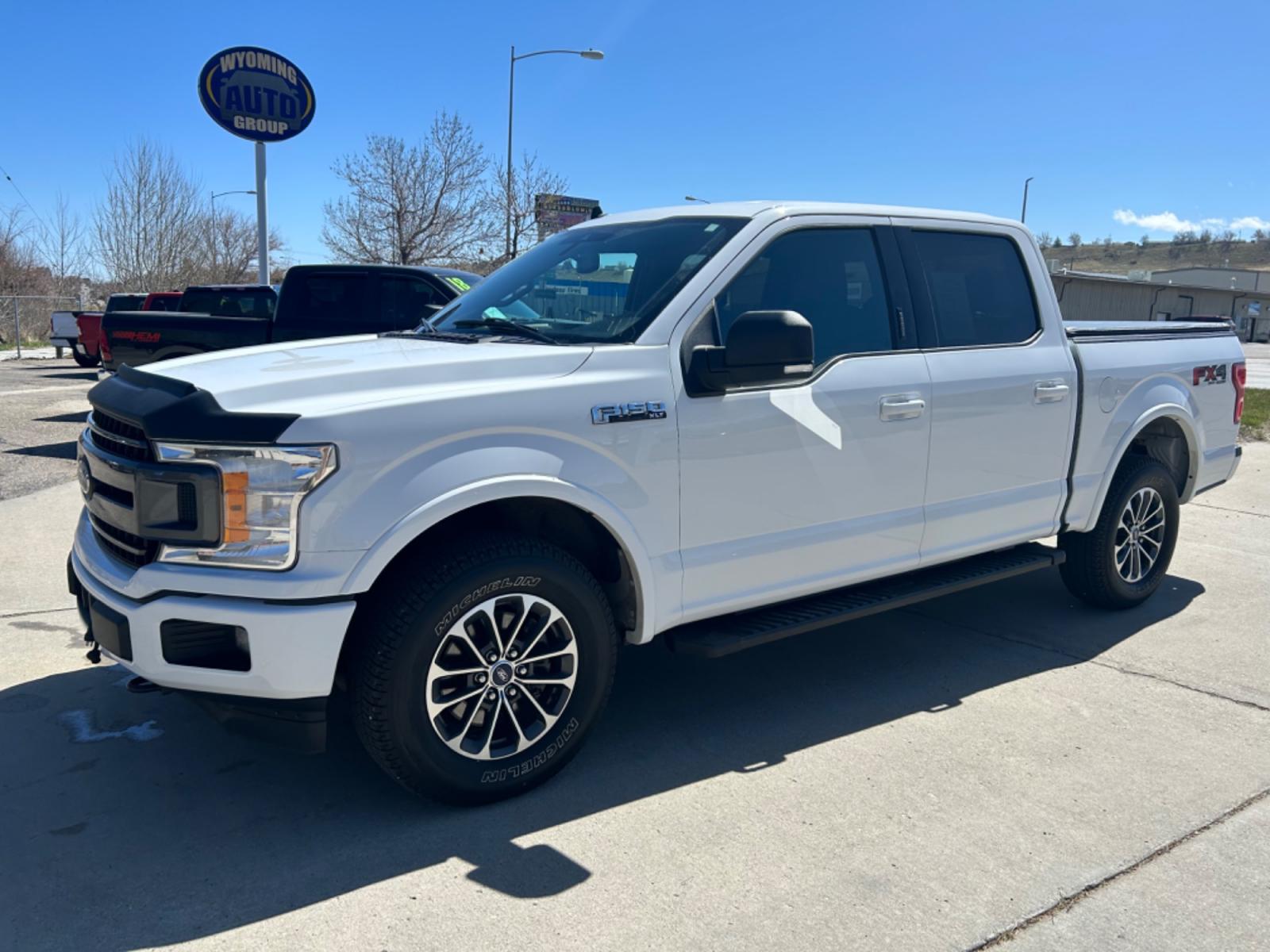 2019 White /BLACK Ford F-150 XLT SuperCrew 6.5-ft. Bed 4WD (1FTEW1E47KF) with an 3.5L V6 TURBO engine, 6A transmission, located at 3030 CY Ave, Casper, WY, 82604, (307) 265-3830, 42.827816, -106.357483 - Check out this beauty! It has the FX4 Off-Road Package, with remote start, and heated seats. Come see how to get into this truck, and be able to off-road with style! - Photo #1